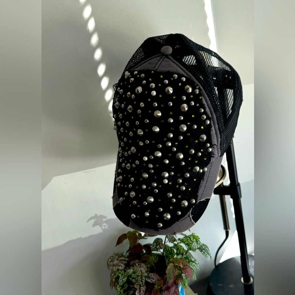 Donatella VERSACE distressed black trucker hat — spikes, studs and Swarovski